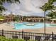 Resort style community pool featuring splash pad, multiple lounging areas, and a lifeguard on duty at 1824 Amberly Ledge Way, Cary, NC 27519