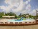 Community pool with a splash pad, slides, and lifeguard stand creating the perfect spot for aquatic fun at 1824 Amberly Ledge Way, Cary, NC 27519
