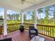 Inviting porch with serene lake views at 1824 Amberly Ledge Way, Cary, NC 27519