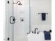 Modern shower with glass doors, white subway tile, and black fixtures at 1824 Amberly Ledge Way, Cary, NC 27519