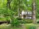 Secluded backyard, nestled among trees and featuring a flowing creek near a charming home at 1846 Forest Wood Rd, Rocky Mount, NC 27804