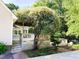 Backyard deck with a large flowering tree and a charming outdoor seating area; great for entertaining at 1846 Forest Wood Rd, Rocky Mount, NC 27804