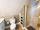 Cozy bathroom featuring a glass shower, toilet, vanity, and storage shelving at 1846 Forest Wood Rd, Rocky Mount, NC 27804