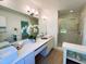 Bright bathroom featuring dual sinks, a large mirror, vanity, and a glass-enclosed shower at 1846 Forest Wood Rd, Rocky Mount, NC 27804