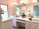Spa-like bathroom with double vanity, marble countertop, and decorative flowers at 1846 Forest Wood Rd, Rocky Mount, NC 27804