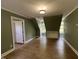 Spacious bedroom with wood floors, natural light from windows, and neutral color palette at 1846 Forest Wood Rd, Rocky Mount, NC 27804