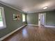 Bright bedroom with wood floors, natural light, with an abstract art piece displayed at 1846 Forest Wood Rd, Rocky Mount, NC 27804