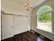 Bedroom features hardwood floors, crown molding, a large window, and a chandelier at 1846 Forest Wood Rd, Rocky Mount, NC 27804
