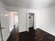 Neutral room featuring hardwood floors, a closet, and natural light; versatile for any decor style at 1846 Forest Wood Rd, Rocky Mount, NC 27804