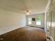 Spacious bedroom with chair rail, two windows and a ceiling fan at 1846 Forest Wood Rd, Rocky Mount, NC 27804