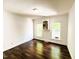Bright and airy bedroom with gleaming hardwood floors, complemented by fresh white walls and two large windows at 1846 Forest Wood Rd, Rocky Mount, NC 27804