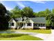 Attractive home features a well-maintained front yard, dormer windows, and gravel driveway at 1846 Forest Wood Rd, Rocky Mount, NC 27804