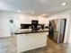 Modern kitchen featuring stainless steel appliances, white cabinets, and a center island at 1846 Forest Wood Rd, Rocky Mount, NC 27804