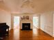 Bright living room boasts a fireplace, hardwood floors, white trim, and double doors on either side at 1846 Forest Wood Rd, Rocky Mount, NC 27804