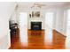 Spacious living room features a fireplace, gleaming hardwood floors, and a ceiling fan at 1846 Forest Wood Rd, Rocky Mount, NC 27804