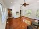 Bright sunroom with hardwood floors, lots of natural light, ceiling fan, and access to the outdoors at 1846 Forest Wood Rd, Rocky Mount, NC 27804
