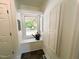 Cozy window nook with storage, natural light, and view of a private backyard at 1846 Forest Wood Rd, Rocky Mount, NC 27804