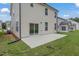 The backyard shows a newly laid lawn, patio and beige siding, creating a serene outdoor space at 2007 Seford Dr, Durham, NC 27703