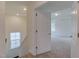 View of bedroom from hall showing carpeted floor and large window at 2007 Seford Dr, Durham, NC 27703