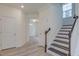 Inviting entryway with staircase and neutral walls at 2007 Seford Dr, Durham, NC 27703