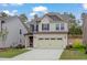 Beautiful two-story home featuring a spacious driveway and welcoming facade at 2007 Seford Dr, Durham, NC 27703