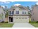 Attractive two-story house with a large garage and well-kept front yard at 2007 Seford Dr, Durham, NC 27703