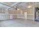 Clean two-car garage with a water heater, concrete floor, and access door to inside the home at 2007 Seford Dr, Durham, NC 27703
