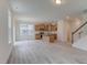 Bright open kitchen featuring light wood cabinets, granite countertops, and stainless steel appliances at 2007 Seford Dr, Durham, NC 27703