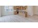 Open kitchen features an island, granite countertops, stainless appliances, and light wood cabinets at 2007 Seford Dr, Durham, NC 27703