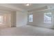 Spacious main bedroom with tray ceiling and multiple windows at 2007 Seford Dr, Durham, NC 27703