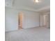 Spacious main bedroom with tray ceiling and multiple windows at 2007 Seford Dr, Durham, NC 27703
