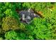 A beautiful aerial view showcases this home surrounded by mature trees and lush greenery at 201 Johnstone Ct Ct, Durham, NC 27712