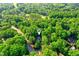 Aerial view showcases neighborhood with mature trees and privacy at 201 Johnstone Ct Ct, Durham, NC 27712
