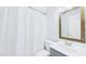 Cozy full bathroom featuring a shower with a curtain, a sink, and a framed mirror at 201 Johnstone Ct Ct, Durham, NC 27712