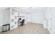 Bright room with hardwood floors, built-in shelves, and desk with natural light at 201 Johnstone Ct Ct, Durham, NC 27712