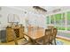 Inviting dining room with a large wooden table, stylish lighting, and ample natural light at 201 Johnstone Ct Ct, Durham, NC 27712