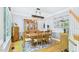 Elegant dining room with a wooden table set for six, complemented by a decorative mirror and cabinetry at 201 Johnstone Ct Ct, Durham, NC 27712