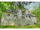 View of home exterior featuring a spacious deck and well-maintained landscaping at 201 Johnstone Ct Ct, Durham, NC 27712