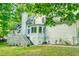 View of home exterior featuring a spacious deck and well-maintained landscaping at 201 Johnstone Ct Ct, Durham, NC 27712