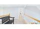 Hallway area features neutral walls, carpeted floor, railing, and a bench at 201 Johnstone Ct Ct, Durham, NC 27712