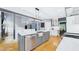 Kitchen featuring stainless steel appliances, shaker cabinets, and island with ample counter space at 201 Johnstone Ct Ct, Durham, NC 27712