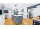 Bright kitchen with stainless steel appliances, white subway tile, and island with seating at 201 Johnstone Ct Ct, Durham, NC 27712