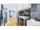 Functional laundry room features modern appliances and a sink at 201 Johnstone Ct Ct, Durham, NC 27712