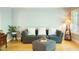 Comfortable sitting area featuring plush gray sofa, ottoman, and decorative accents at 201 Johnstone Ct Ct, Durham, NC 27712