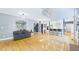 Spacious open-concept living area with high ceilings, hardwood floors, and seamless flow to the kitchen at 201 Johnstone Ct Ct, Durham, NC 27712