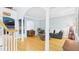 Bright living room with hardwood floors, decorative columns, and ample natural light from large windows at 201 Johnstone Ct Ct, Durham, NC 27712