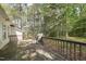 A wooden back deck overlooking a wooded lot at 2028 Ruddy Rd, Raleigh, NC 27616