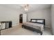 This bedroom features neutral colors and connects to the laundry room for added convenience at 2028 Ruddy Rd, Raleigh, NC 27616