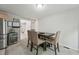 Dining area with seating for four, neutral gray paint, and views of the kitchen at 2028 Ruddy Rd, Raleigh, NC 27616