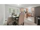 Eat-in kitchen area featuring wood table and chairs near french doors at 2028 Ruddy Rd, Raleigh, NC 27616